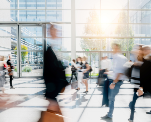 busy office lobby with people rushing