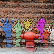 hand mural on brick wall