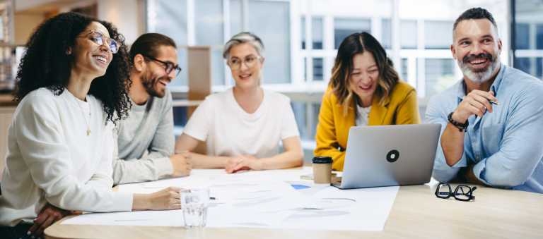 Cheerful Design Professionals Smiling Happily During A Meeting