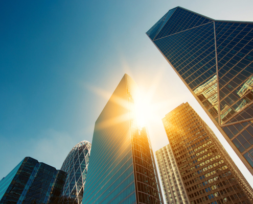 Skyscraper Glass Facades On A Bright Sunny Day With Sunbeams