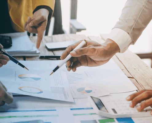 Three legal professionals engage in financial decision-making.