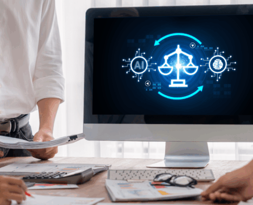 Three legal professionals standing around a desk reviewing documents while a computer screen displays an AI and justice scales graphic, representing the use of artificial intelligence in legal work.