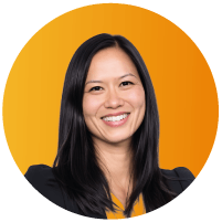 Headshot of Shu White, Chief Legal Officer and Head of People at Motive, smiling against an orange circular background.